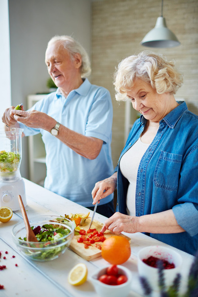 Senior couple cooking - Фото, изображение