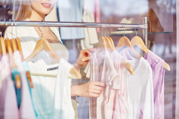 Woman choosing new blouse - Foto, Imagen
