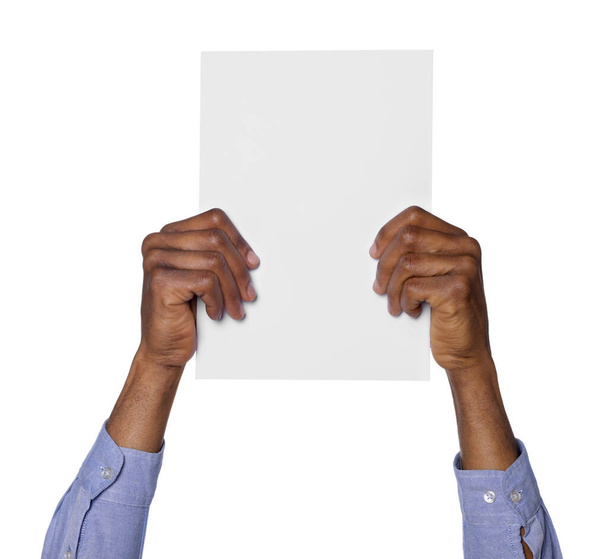 African American man holding sheet of paper on white background, closeup. Mockup for design - Valokuva, kuva