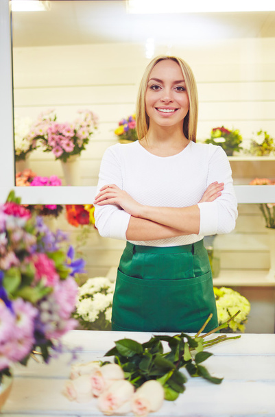 Seller of flowers on workplace - Photo, image