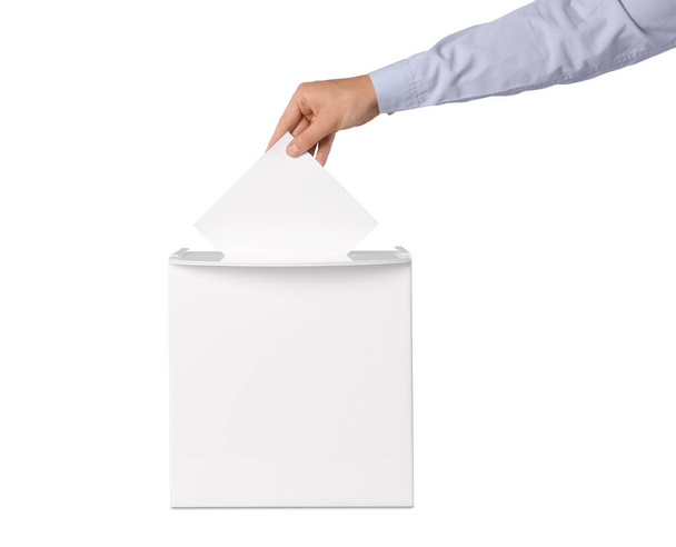 Man putting his vote into ballot box on white background, closeup - Fotoğraf, Görsel