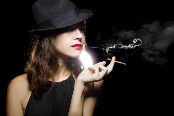 Female vaping an electronic cigarette - Foto, afbeelding
