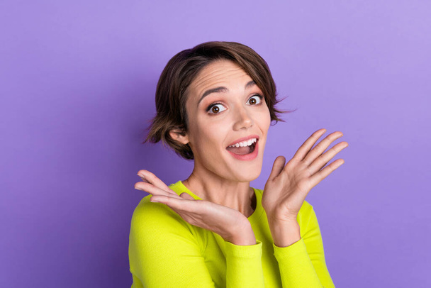 Portrait of young funky girl laugh positive enjoy her boyfriend gift surprised reaction wear yellow top isolated on violet color background. - 写真・画像