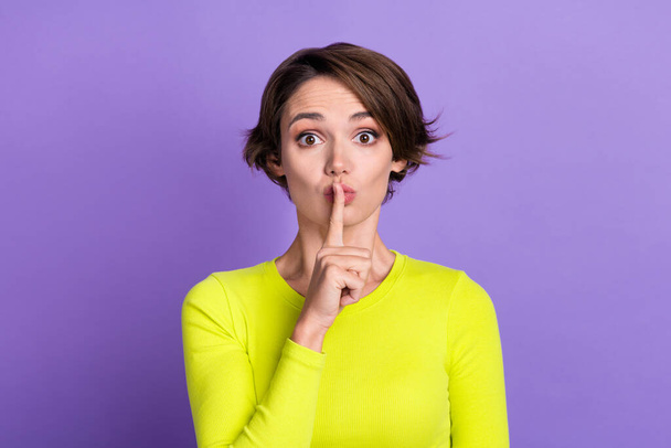 Photo of girl pouted lips finger muted no words information confidential information be quiet symbol isolated on violet color background. - Foto, Imagen