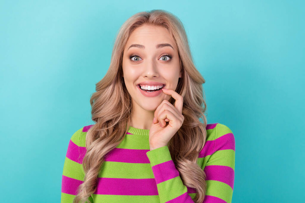 Portrait of optimistic satisfied impressed girl wear stylish clothes finger on lips astonished staring isolated on blue color background. - Photo, Image