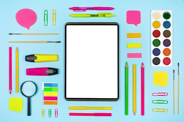 Various colorful school supplies and digital tablet with blank display on blue background. Top view with copy space - Φωτογραφία, εικόνα