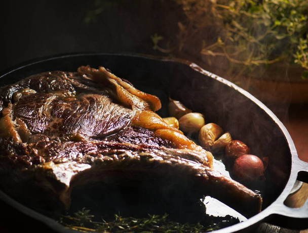 Cooking lamb steak on a pan food photography recipe idea - Photo, image