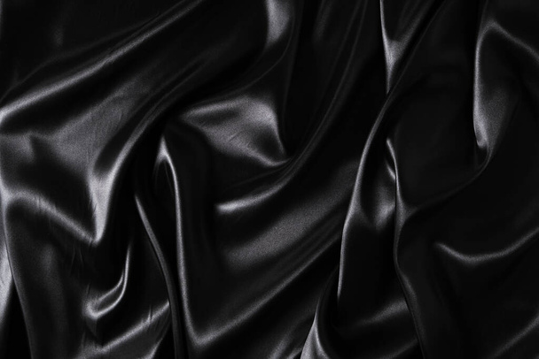 Silk fabric, abstract wavy black satin fabric background - 写真・画像