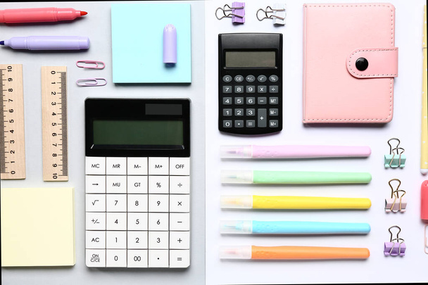 Modern calculators with different stationery on color background - Zdjęcie, obraz
