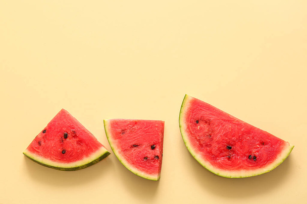 Pieces of fresh watermelon on yellow background - Photo, image