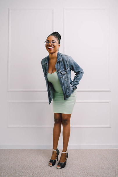 African American woman in light green dress with jacket. Beautiful black woman in modern casual - Photo, Image
