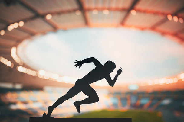Sprinting through Dusk: Silhouette of a Male Athlete, a Long-Distance Runner, Resiliently Pursuing Excellence at a Modern Sports Stadium - Foto, afbeelding