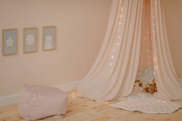 The interior of the children's room in beige tones and boho style - Fotó, kép