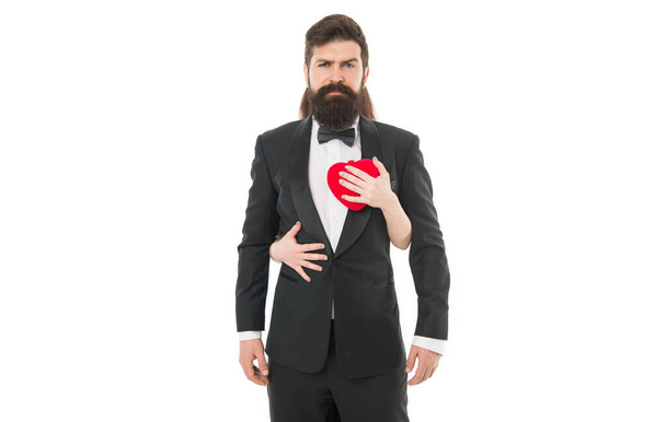woman embrace man and touch heart. tuxedo man in love. bearded man touched by female hands. valentines day concept. couple in love. heart is love symbol. she stole his heart. - Fotoğraf, Görsel