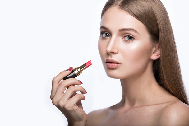 Charming young babe with lipstick and light makeup. - 写真・画像