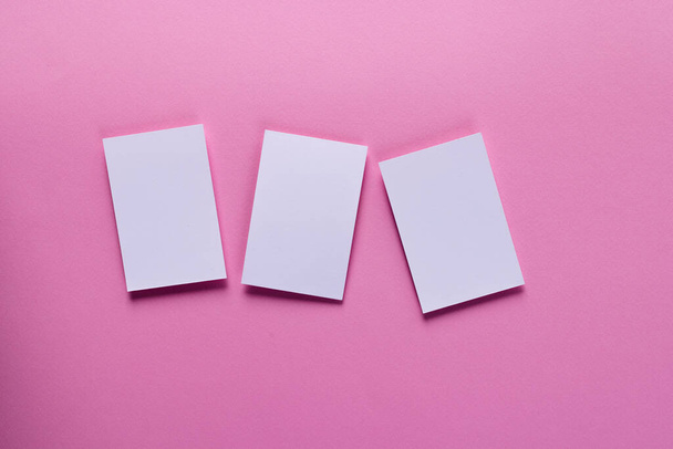 White business cards with copy space on pink background. Business, business card, stationery and writing space concept. - Valokuva, kuva