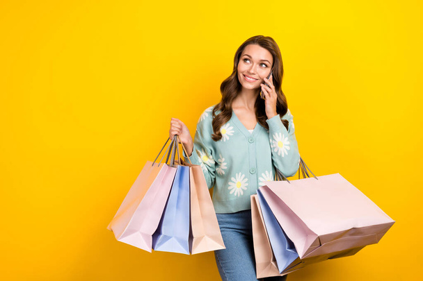 Photo of young influencer fashionista blogger lady call smartphone commerce proposition look empty space bargains isolated on yellow color background. - Fotoğraf, Görsel