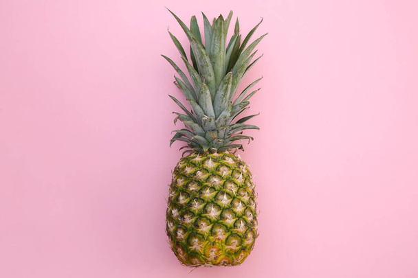 Whole ripe pineapple on pink background, top view - Fotoğraf, Görsel