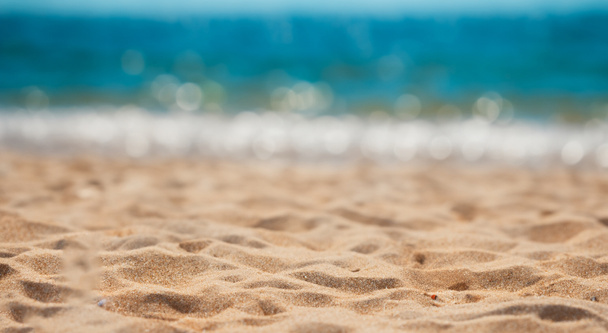 bella spiaggia di sabbia con il mare sullo sfondo sfocatura - Foto, immagini