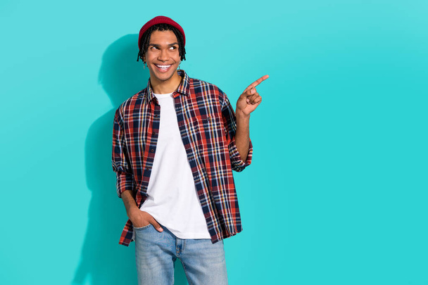 Photo portrait of attractive young male point look empty space promotion wear trendy plaid garment isolated on aquamarine color background. - 写真・画像
