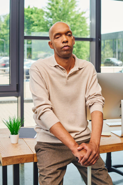 inclusion, bold african american businessman with myasthenia gravis syndrome, standing with walking cane near computer monitor on working desk, dark skinned office worker in casual attire - Photo, Image
