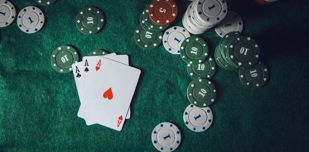 Poker playing chips on a green table - Foto, imagen