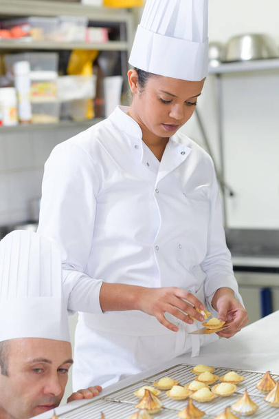 a pastry apprentice at work - Foto, immagini
