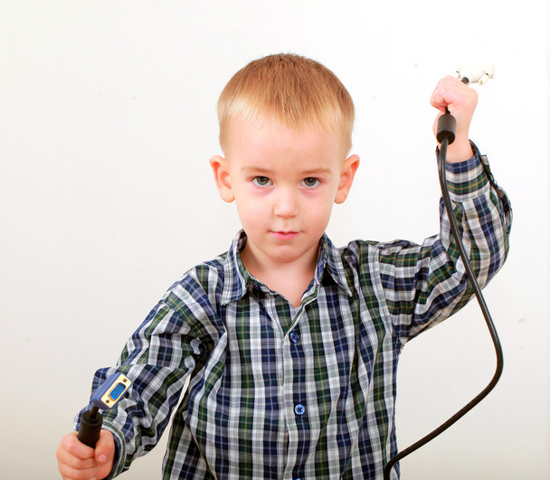 Little boy with computer cables - Photo, Image