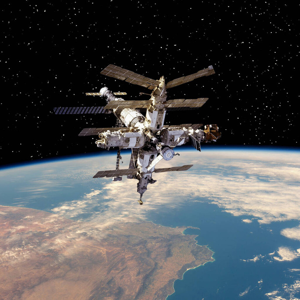 Stacja Kosmiczna nad ziemią. Elementy tego obrazu dostarczone przez NASA - Zdjęcie, obraz