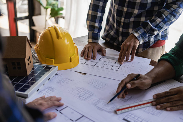 house design architect inspect the house customer-specified projects and according to the model before delivery Engineer in office with blueprints, on-site inspection for architectural plans, construction projects, business construction - Photo, image