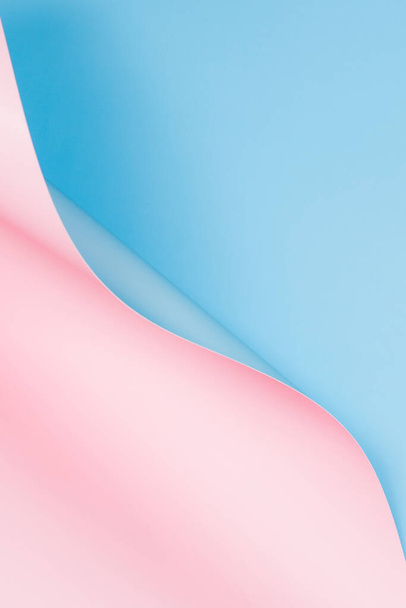 Abstract wave of pastel pink and light blue paper. Creative geometric curved paper with light and shadows. Abstract geometry background with copy space. - Photo, Image
