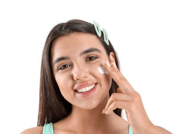 Beautiful young woman applying sunscreen cream on white background, closeup - Foto, Imagem