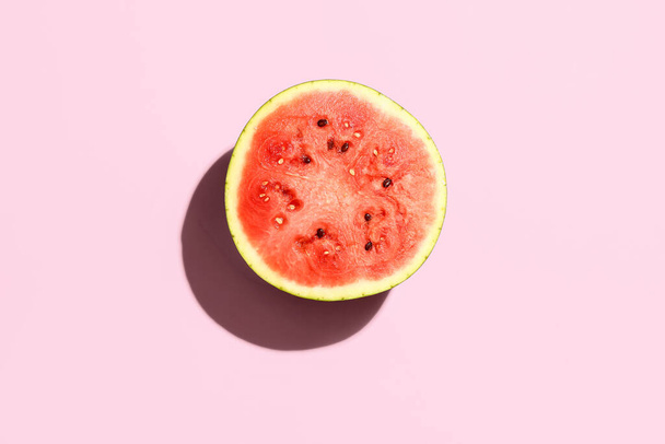 Half of fresh watermelon on pink background - Fotografie, Obrázek