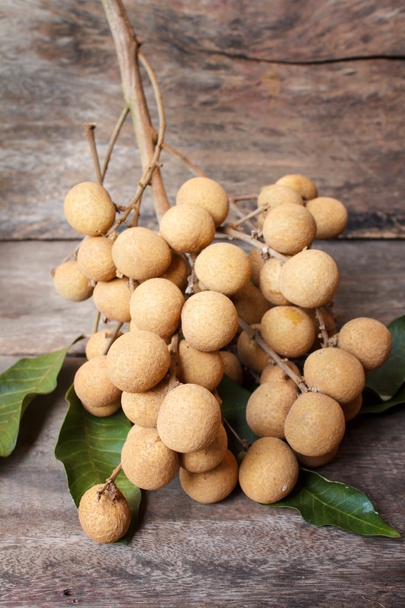 Longan on old wooden table. - Photo, image