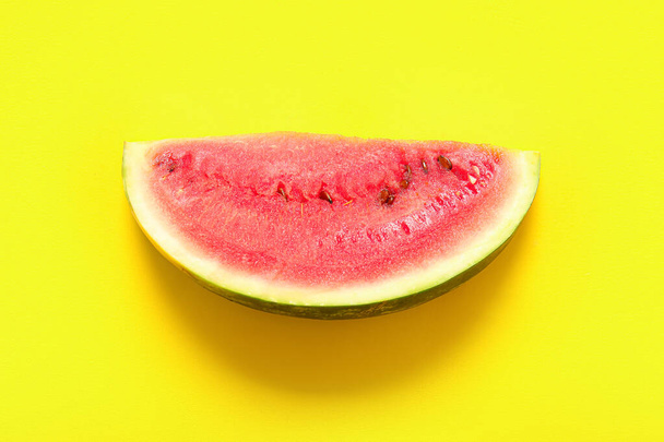 Piece of fresh watermelon on yellow background - Fotografie, Obrázek