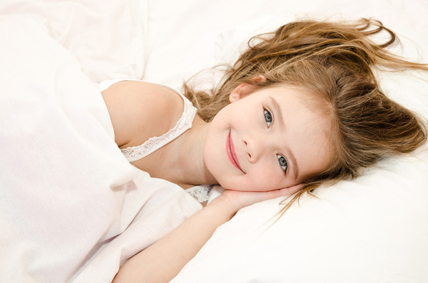 Adorable smiling little girl waked up - Foto, immagini