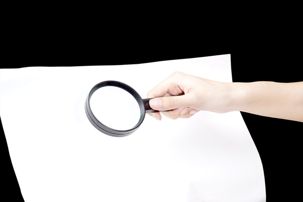 A magnifying glass hovering over as Inspection - Photo, Image