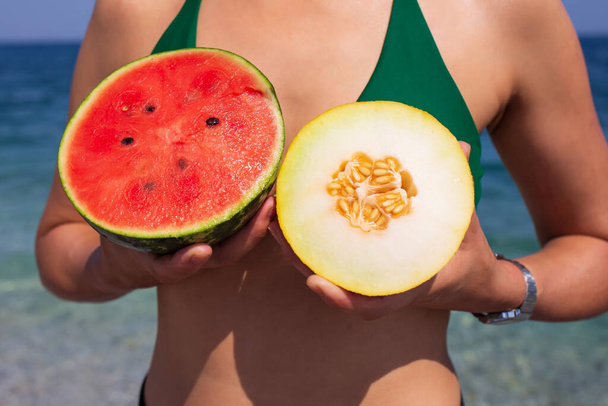 woman with piece of watermelon on the beach - Foto, Bild