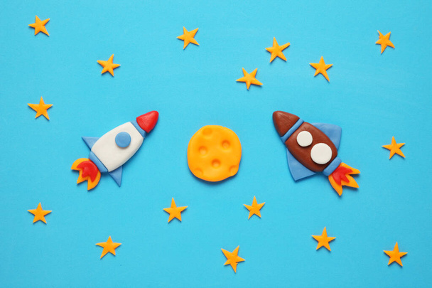 Two kid (child) rocket in space, adventure and science. Stars, and moon. Plasticine art, cartoon. - Fotó, kép