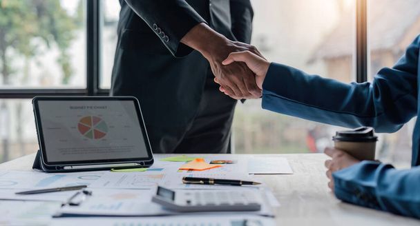 Business people, handshake and partnership in meeting for hiring, agreement at office. Happy businessman shaking hands in recruiting, teamwork or introduction. - Photo, Image