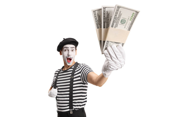 Mime holding stacks of money isolated on white background - Фото, изображение