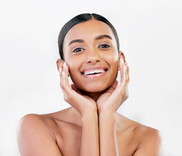 Beauty, skin and face portrait of a happy woman with natural glow isolated on a white background. Dermatology, makeup and cosmetics of Indian female model for facial shine or self care in studio. - Foto, Imagen