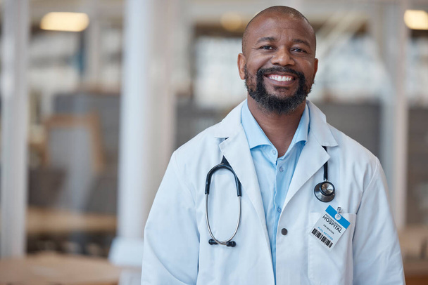 Doctor, portrait and smile with black man at hospital or lab coat with confidence or leader. Healthcare professional, happy and face with manager or positive mindset at clinic with vision or expert - Foto, Imagem
