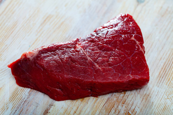 Fresh raw meat, piece of beef sirloin steak on wooden background - Fotoğraf, Görsel