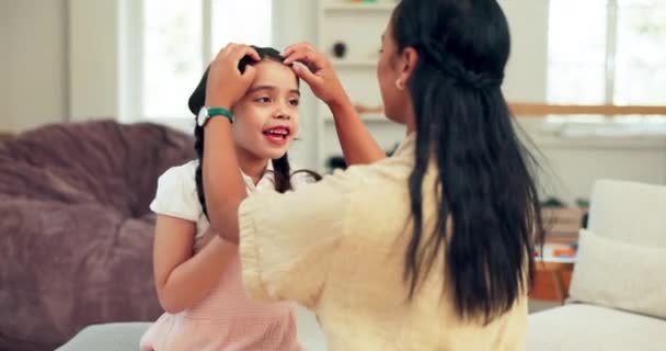 Care, love and mother doing child hairstyle in home prepare or ready for back to school in the morning as support. Mum, daughter and parent affection with kid for education as routine to leave house. - Materiaali, video