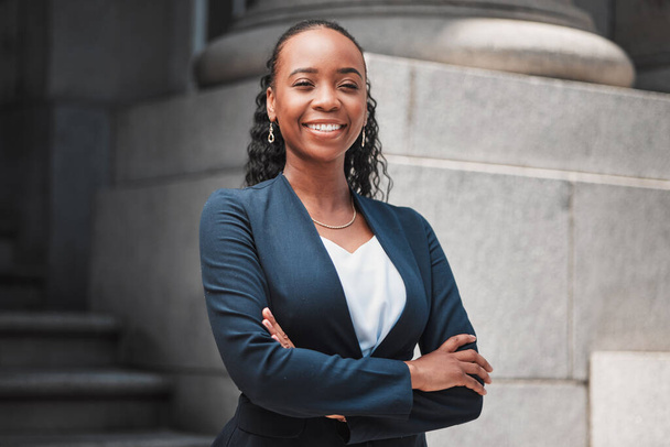 Arms crossed, attorney or portrait of happy black woman with smile or confidence working in a law firm. Confidence, empowerment or proud African lawyer with leadership or vision for legal agency. - Foto, afbeelding