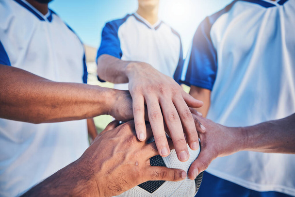 Sports, huddle and football team with their hands together on the ball for motivation, empowerment or unity. Fitness, group and athletes or soccer players in a circle before game, match or tournament. - Foto, Imagem