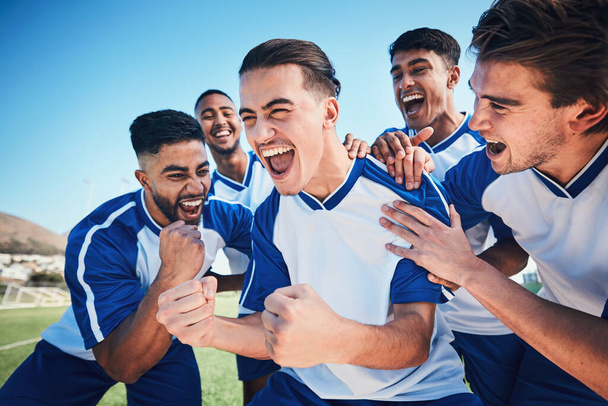 Winner, goal and soccer with team and happiness, men play game with sports and celebration on field. Energy, action and competition, male athlete group and football player cheers with success outdoor. - Fotografie, Obrázek