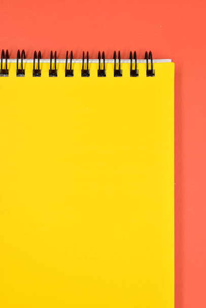 yellow notebook on orange background, stationery for office - Photo, Image