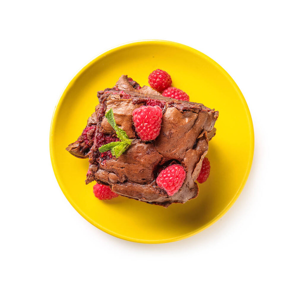 Plate with pieces of raspberry chocolate brownie on white background - Foto, Imagem